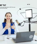 9 Inch LED Video Light Panel With Dimmable Output on desk with tripod stand, illustrating 180° tilt feature for studio lighting
