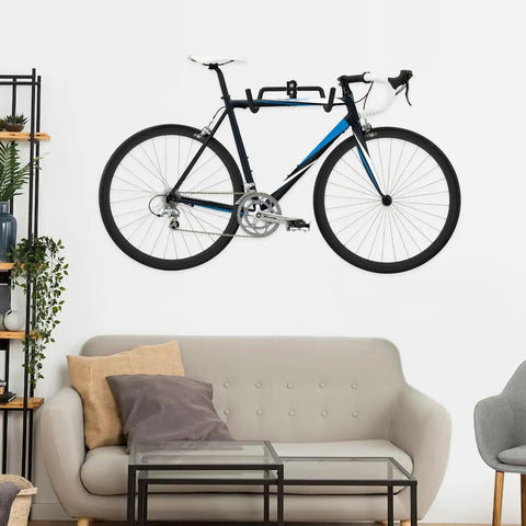 Heavy Duty Steel Bike Wall Mount Hanger For Garage Storage Foldable Arm Bike Rack Indoor Wall Mount Holder Fits Road And Mountain Bikes Adjustable Sturdy Up To 55 Lbs 2 Pack holding a bicycle in a living room