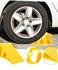2 Pack Heavy Duty Rubber Wheel Chocks positioned against vehicle tire, showcasing sturdy yellow design and grip treads.