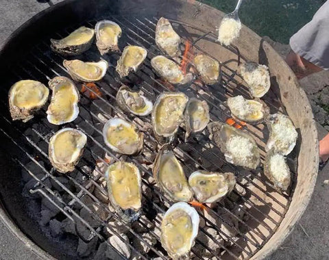 Grilled oysters on BBQ grill for backyard seafood prep using Premium Stainless Steel Oyster Opener With Knife On Wooden Base