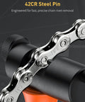 Close-up of Heavy Duty Bike Chain Breaker Tool for 5 to 12 Speed and Single Speed Chains with chain hook in use
