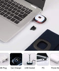 Hands Free LED Beanie With USB Rechargeable Headlamp for Kids charging via laptop, navy blue hat nearby.