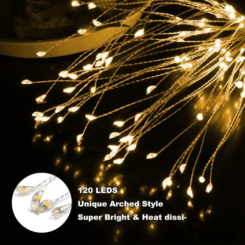 Close-up of 120 LED Two Pack Solar Firework Copper Wire Lights bending in warm glow, outdoors, showing unique arched style.