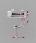 Reliable Mini Bench Vise With Quick Release Table Clamp And Drill Press Mount holds rock solid, showcasing a sturdy metal construction.