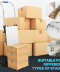 Top Tier Electric Stair Climbing Dolly For Heavy Duty Moving With 880 Lbs Capacity, 1200W Motor And Foldable Design in front of stacked boxes.