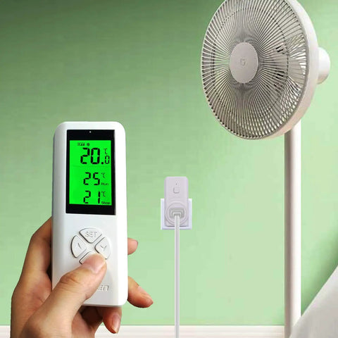 Hand holding remote for Wireless Thermostat Outlet With Digital Temperature Controller For Cooling And Heating Plug In