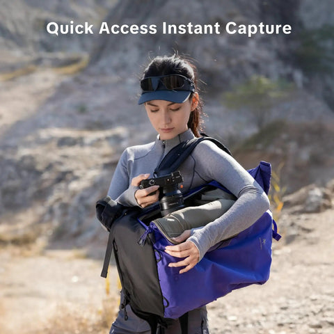 Photographer using Ultralight Camera Backpack For Photographers Expandable To 40L Space Black Suspended Back Panel outdoors.