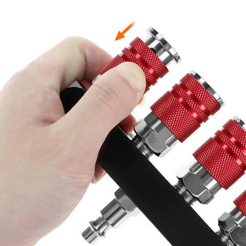 Hand attaching coupler on Four Way Straight Air Manifold With Five Ports And One Quarter NPT Inlets Aluminum Line Type Splitter