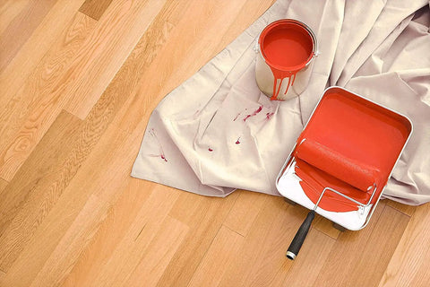 Heavy Duty Cotton Canvas Drop Cloths 4x5 Feet Pack Of 4 Thick Painter Cloths To Protect Furniture And Floors From Paint Messes During DIY Projects And Messy Painting Jobs covering floor with red paint bucket and roller.