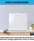 Hella Solid Upright Freezer One Point Two Cubic Feet White Compact Frost Vault With Wire Rack placed on countertop in sleek design.
