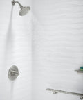 Devonshire Rite-Temp Shower Valve Trim With Lever Handle And 2.5 GPM Showerhead in modern white tile bathroom