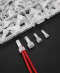 Rock Solid 120 Pack Closed End Crimp Connectors For Electric Pros. Heavy Duty Nylon Insulated Tips In 22-16, 16-14 And 12-10 Gauge Sizes Guarantee Snug Fits Plus Safety Certs That Keep Your Gear Short Circuit Free And Looking Sharp On Any Rig. Close-up of white nylon insulated closed end crimp connector on red wires.