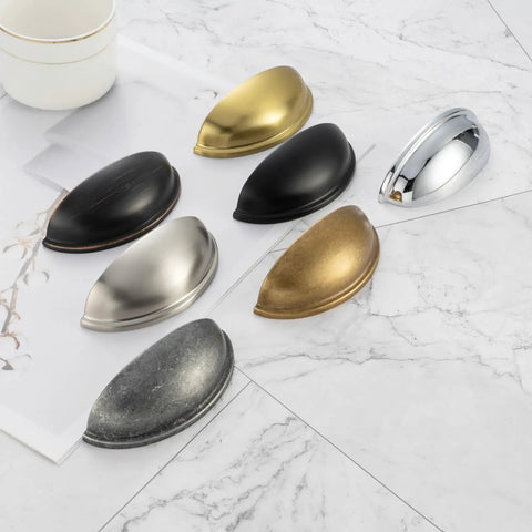 Assorted metal drawer pulls including Chrome Bin Cup Drawer Pulls 3 Inch Center Spacing 76mm Cabinet Handles 25 Pack on marble surface
