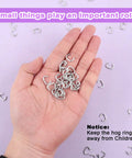 Heavy Duty Galvanized Hog Rings Assortment Kit 1000 Pcs 3 8 Inch Steel Loop Pins in a hand, metallic hog rings for upholstery and pet cages.