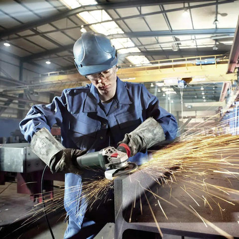 Worker using Beefy Torque 5 Inch Variable Speed Angle Grinder With Electronic Speed Control 2800 To 11000 RPM for grinding metal