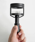 Knock Out Stubborn Clumps Heavy Duty Espresso Wdt Tool With 51mm Concentric Needles And Secure Magnetic Base Adjustable Depth in hand.