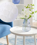 Anti Slip Silicone Pads For Glass Tables With 132 Pcs Adhesive Dots and Grippers on white table under a glass vase