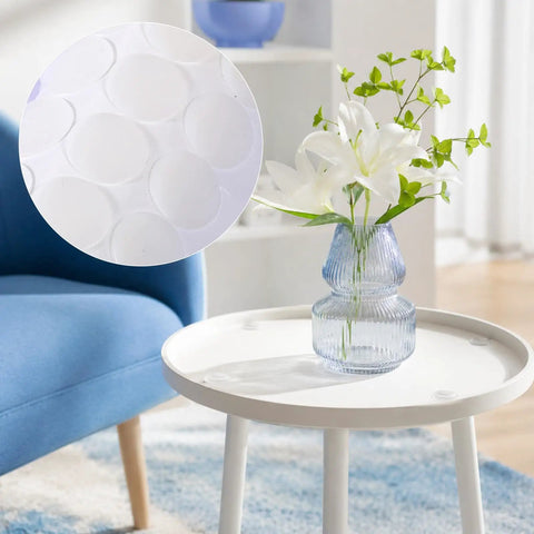Anti Slip Silicone Pads For Glass Tables With 132 Pcs Adhesive Dots and Grippers on white table under a glass vase