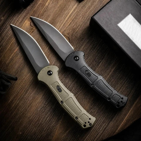 EDC Ready Folding Knife With D2 Steel Blade And Non Slip Fiberglass Handle, black and green handle, on wooden surface