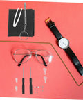 Eyeglass Repair Tools Kit With Screws Nose Pads And Tiny Screwdriver For Quick Glasses Fix On The Go Portable Eyewear Maintenance Kit For Enthusiasts And DIY Fixers displayed with glasses and a watch.
