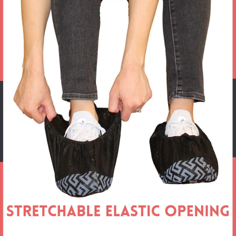 Person putting on Extra Thick Disposable Shoe Covers XL 100 Pack One Size Fits Most With Non Slip Soles For Indoor Outdoor Use Black
