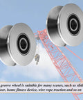 Beefy Build Sliding Gate Rollers With Stainless Steel V Groove Wheels And Cable Pulley Block shown near construction crane