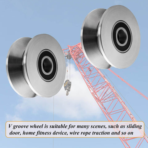 Beefy Build Sliding Gate Rollers With Stainless Steel V Groove Wheels And Cable Pulley Block shown near construction crane