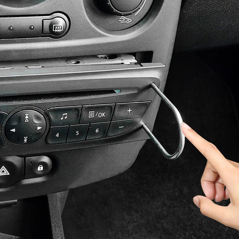 Heavy Duty 4 Piece Car Radio Pry Tool Set With 2 U Shaped And 2 V Shaped Stainless Steel Tools used on a car dashboard