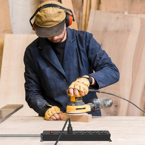 Man using a sander in workshop with Heavy Duty Power Strip With 20 Amp Surge Protector 1200J on workbench
