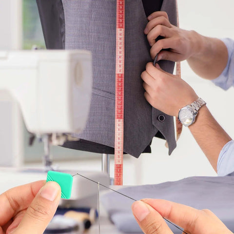Man using sewing tools with a 10 Pack Automatic Needle Threaders For Sewing Machines Self Threading Tool For Embroidery Floss Hand Sewing And Cross Stitch Plastic Threader That Fits All Needle Sizes In A Color Set Of Red Yellow Blue Green And Gray Must Have For Every Sewing Hobbyist.