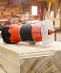 Router Tool 6.5 Amp Wood Router With One And A Quarter HP 30000 RPM Built For Woodworking on a wooden surface in workshop
