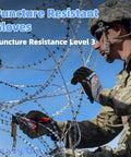 Man wearing Dual Nitrile Coated Work Gloves ANSI A9 Cut Abrasion Puncture Resistant handling barbed wire in military setting.
