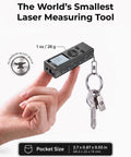 Ultra-Compact Laser Distance Meter Keychain Tool with backlit display, shown in hand with keys, aluminum body, pocket size.