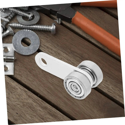 Heavy Duty Sliding Door Roller Wheels With Dual Bearing Iron Groove Caster on wooden surface among various hardware tools.