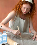 Artist using air dry clay varnish sealant for air dry clay waterproof and scratch resistant gloss glaze that prevents cracks and wear.