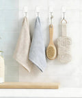 Clear Wire Wall Hooks With Removable Adhesive Strips No Damage Hacks For Ultimate Organization holding towels and bath brush.