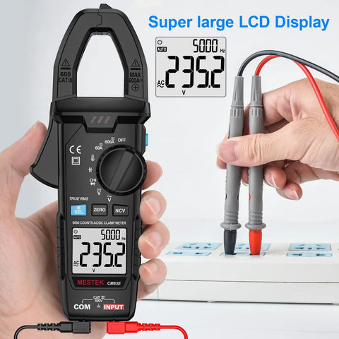 True RMS Clamp Meter Multimeter measuring AC voltage with 6000 counts display and probes connected to power strip