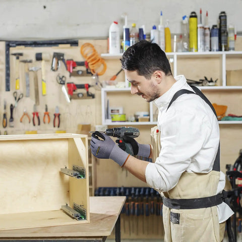 Man wearing General Purpose Nitrile Coated Work Gloves With Micro Foam Nitrile Grip so good for light oils assembling furniture