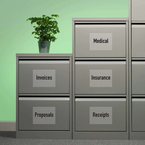 Gray metal filing cabinet with labeled drawers showing Medical, Invoices, Insurance, Proposals, Receipts.
