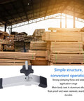 Badass Two Pack T Slot Hold Down Clamps Featuring M8 Threads And Scratch Free Soft Jaws For Router Tables Cnc Mills And Drill Press Jigs Rock Solid Shop Essential positioned with wooden stacks in background.