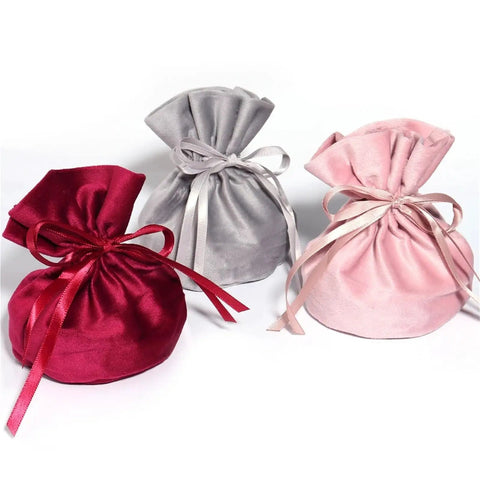 Velvet Drawstring Jewelry Bags Set, 12 Pack Colorful Ribbon Storage Pouches For Jewelry Protection in red, grey, and pink.