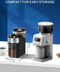 Adjustable 28 Settings Burr Coffee Grinder For Home Use With Stainless Steel Flat Burrs and compact design next to coffee cup.