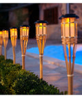 Bamboo Solar Torch Light Outdoor Garden Pathway Landscape Spike Spotlight Tiki Torch With Warm White LEDs Auto On Off By Light Sensor No Wiring 60cm Handcrafted Patio Lighting Ten Pack along poolside pathway; warm glow.