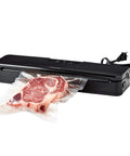 Slim Compact Vacuum Sealer For Sous Vide And Meal Prep, Dual Wet And Dry Sealing sealing a steak in a BPA Free Bag