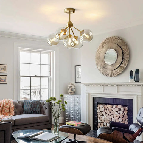 5 Light Amber Glass Globe Chandelier With Brass Gold Finish in living room, mid century modern ceiling light fixture