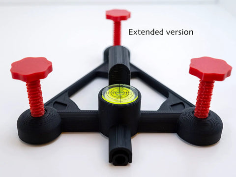 Rock Solid Golf Launch Monitor Stand With Quick Height Adjustments From Quarter Inch To Two Inches showing extended version with red knobs.