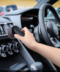 Person using 36mm Long Horse Hair Vacuum Brush With Universal Connector For 32mm And 1-1/4 Hose on car dashboard showcasing soft bristles
