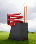 Portable Golf Ball Dispenser With Automatic Ball Delivery And Smart Tee Up System on grass with red spiral ramp