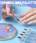 Nail Art Tools Set With 23 Pcs Brushes And 5 Pcs Dotting Tools, resin palette, and brushes in use on designed nails.