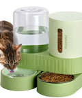 Automatic Pet Feeder And Gravity Water Dispenser Set Giving Busy Pet Parents A Peace Of Mind With Heavy Duty Stainless Steel Bowls For Cats Dogs And Puppies Ensuring Fur Kids Stay Well Fed And Hydrated Daily In Green with a cat drinking water.